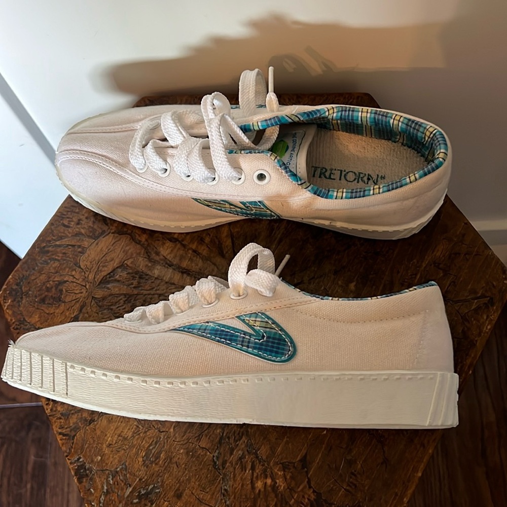 Tretorn white canvas sneakers. Blue/green tartan/plaid trim.